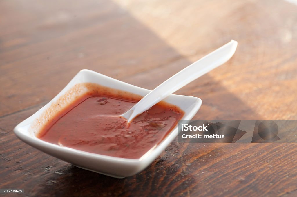Sauce in small bowl Sauce in small bowl on a table Barbeque Sauce Stock Photo