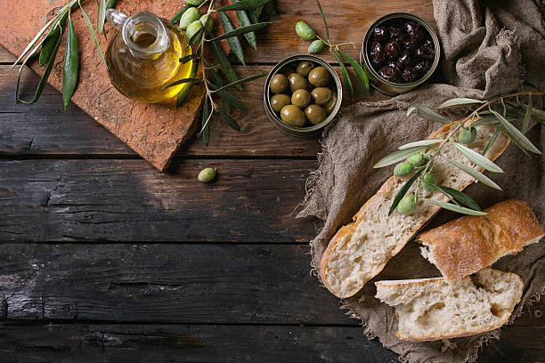 istock Olives with bread and oil 615909586