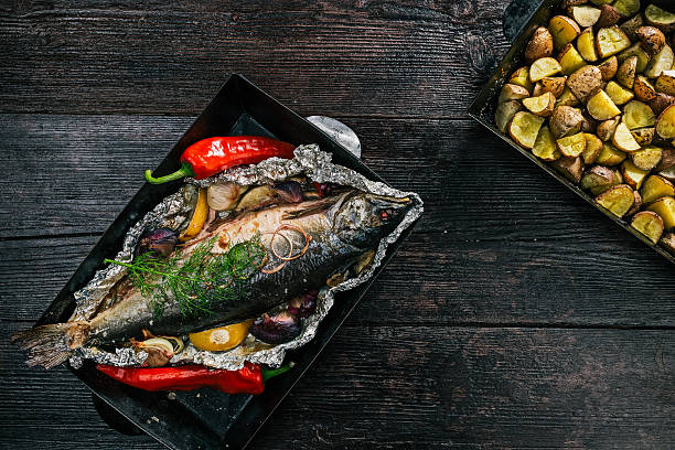 istock Salmon and potato baked on tray 615913572