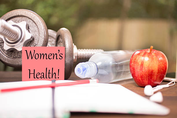 istock Fitness, exercise themed scene with Women's Health note. 615915514