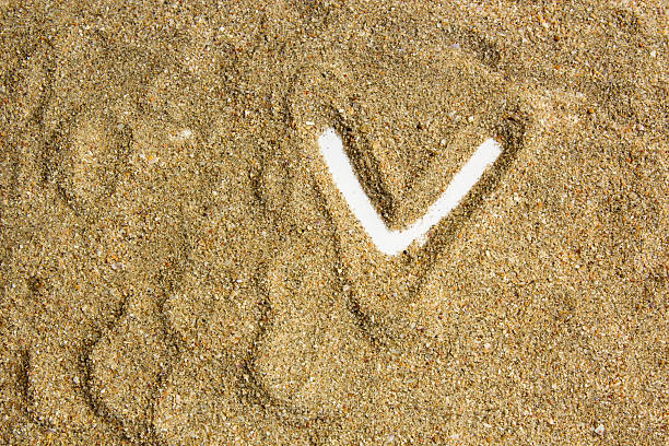 nine o'clock: little stick in the sand on the beach