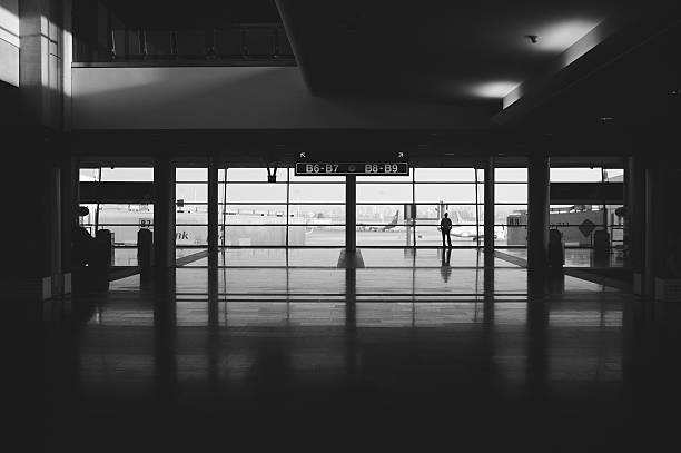 man standing alone in the ben gurion airport