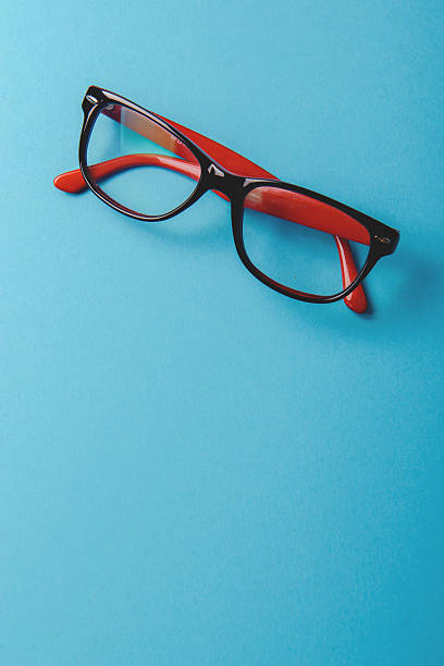 istock pair of red plastic-rimmed eyeglasses 615920164