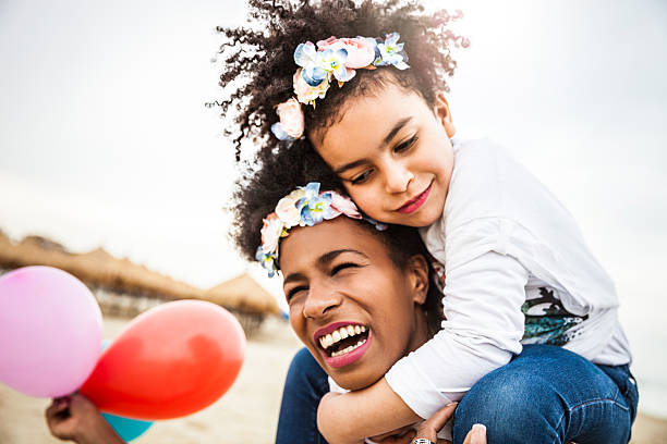 istock Mother and child play together celebrating 615920188