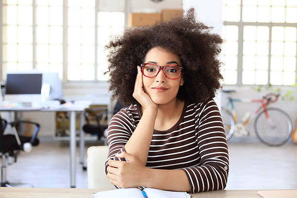 istock Cheerful young woman resting at workplace 615920314