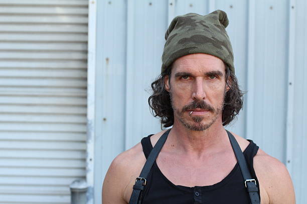 istock Portrait of a serious pierced man 615920796
