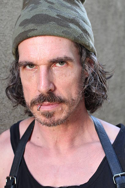 istock Portrait of a serious pierced man 615921036