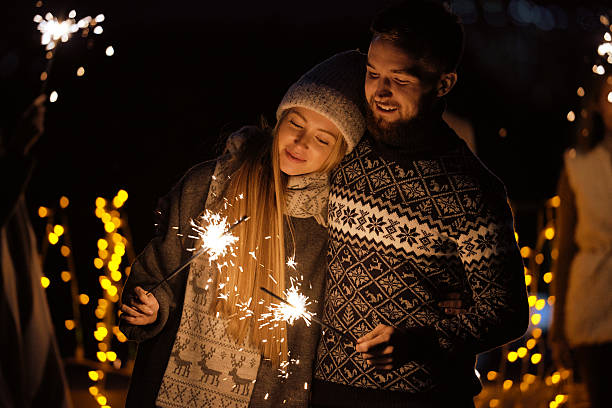 istock Romantic couple with sparklers 615921542
