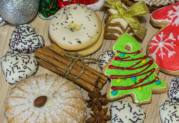 istock Gingerbread cookies with different shapes, cinnamon sticks 615921838