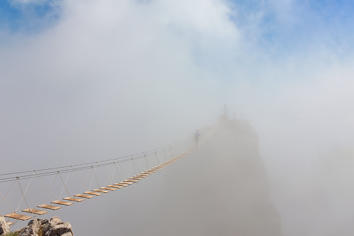 Man in fog over chasm
