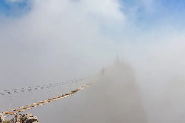 Photo of Man in fog over chasm