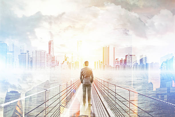 istock Man standing on bridge and looking at big city 615922482