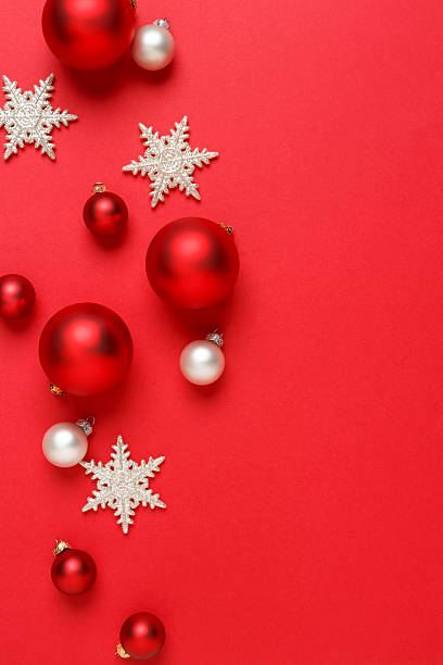 istock Christmas decorations ornaments simple classic red background vertical border 615924208