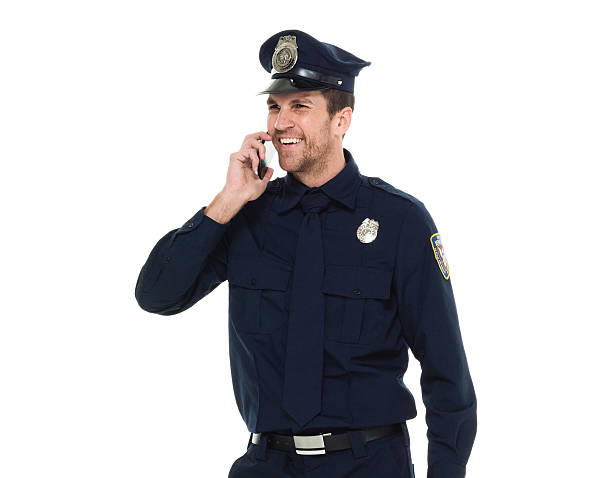 istock Smiling police talking on phone 615925802