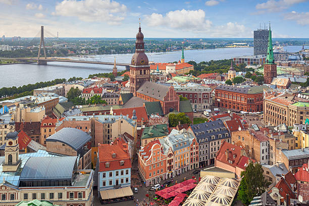 Riga, capital of Latvia A view over central Riga, Latvia, with Riga Cathedral and Daugava River in the background. latvia stock pictures, royalty-free photos & images