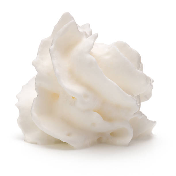 istock Whipped cream swirl  isolated on white background cutout 615927170