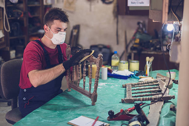 istock Sanding the baby crib 615927908