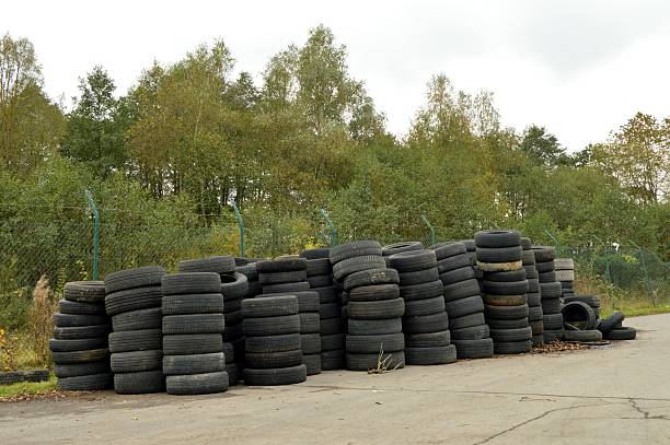 Heap of old tires user in a center of recycling.