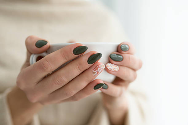 istock well-groomed hands with a cup of tea 615973926