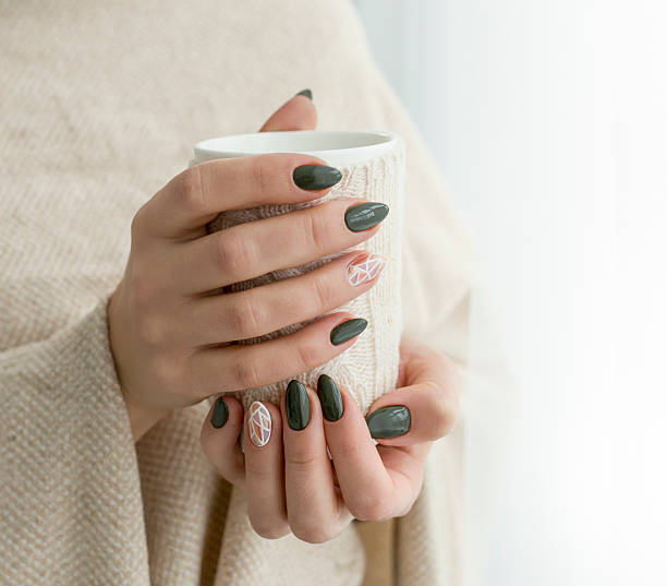 istock well-groomed hands with a cup of tea 615974044