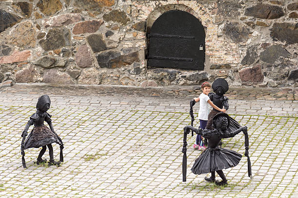 Oslo, Norway - July 18, 2016:DANCING CLOG GRILS, sculpture by Laura Ford at Akershus fortress, 2016, Oslo, Norway. Akershus castle and fortress is a fine place to encounter the work of the British sculptor, Laura Ford (b.1961). 
