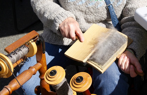Carding wool is the first step in preparation for spinning it into thread to make clothes and other items. The wool fibers are carded by hand for hand spinning using a card tool with hair brush like prongs. 