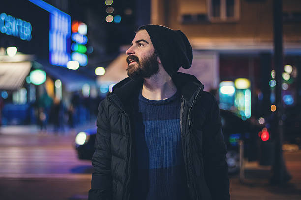 istock Happy bearded man in the city at night 615975270