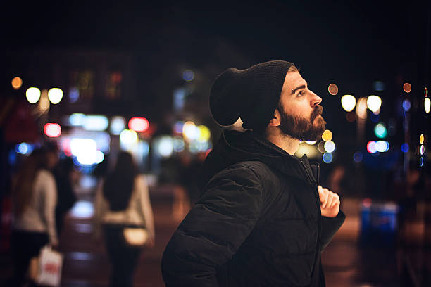istock Bearded man in the city at night 615976506