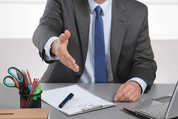 istock Businessman ready to shake hand in office 615979470