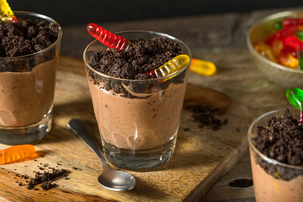 Homemade Chocolate Dirt Pudding Homemade Chocolate Dirt Pudding with Gummy Worms mousse dessert stock pictures, royalty-free photos & images