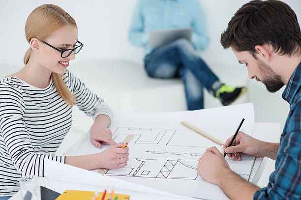 istock Group of young architects at office 615980336