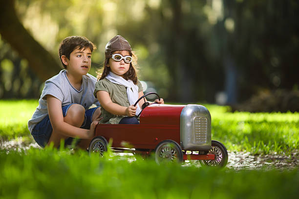 istock Cuban kids playing with vintage toy car 615980360