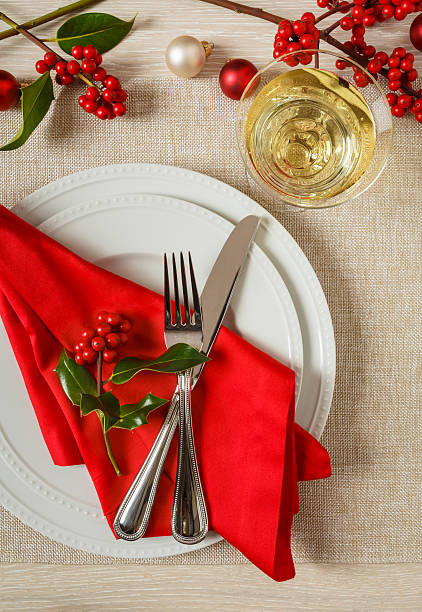 istock Festive Christmas holiday table setting place setting dinner party decorations 615981362