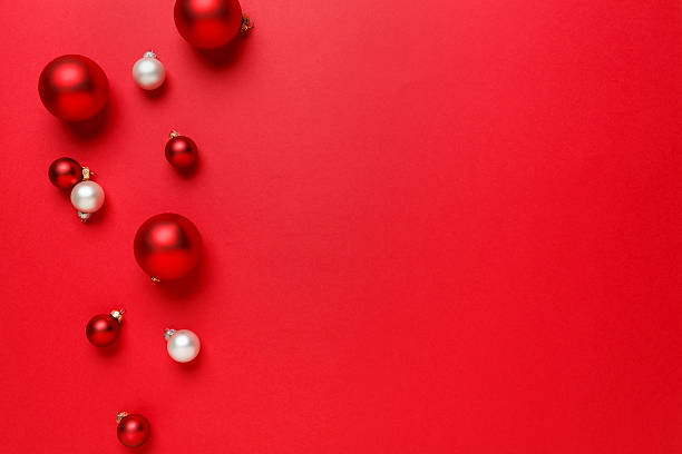 istock Christmas decorations ornaments simple classic red background horizontal border 615981696