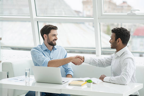 istock Employees of creative team shaking hands 615982698