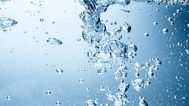 Blue water wave and bubbles to clean drinking water Blue water wave and bubbles to clean drinking water purified water stock pictures, royalty-free photos & images