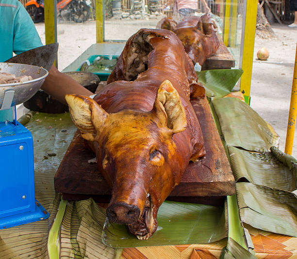 istock Carcass of roasted pig, roasted pork head 615985264