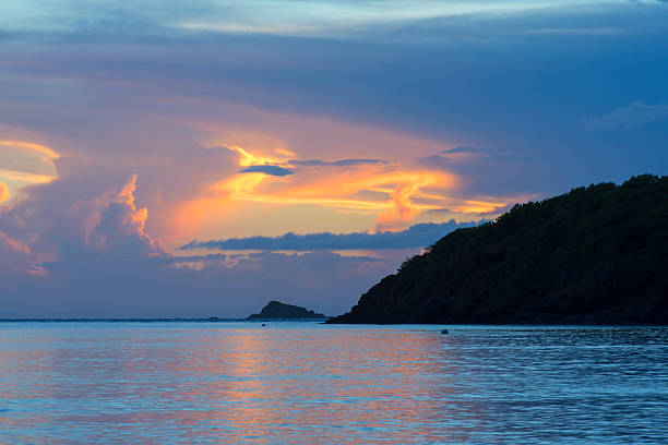 Window to heaven Vividly illuminated opening in gray clouds during sunset over the sea on the Caribbean island of Isla Culebra in Puerto Rico culebra island photos stock pictures, royalty-free photos & images