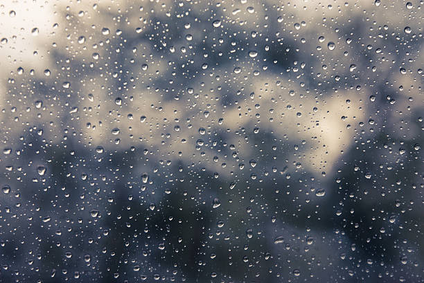 istock Drops of rain on glass , rain drops on clear window 615986744