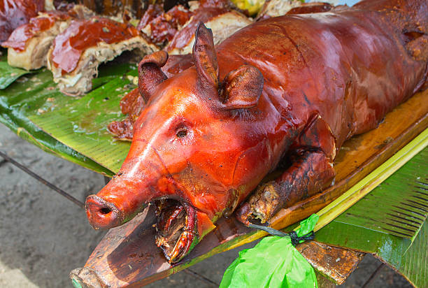 istock Carcass of roasted pig, roasted pork head 615987102