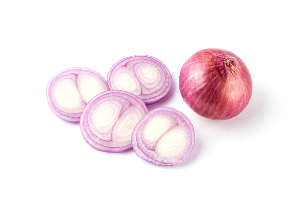 istock Red sliced onion isolated on white background 615987376