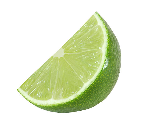 istock cut lime fruits isolated on white background with clipping path 615988046