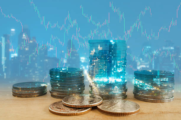 istock Double exposure of city and coin stacks. 615988668