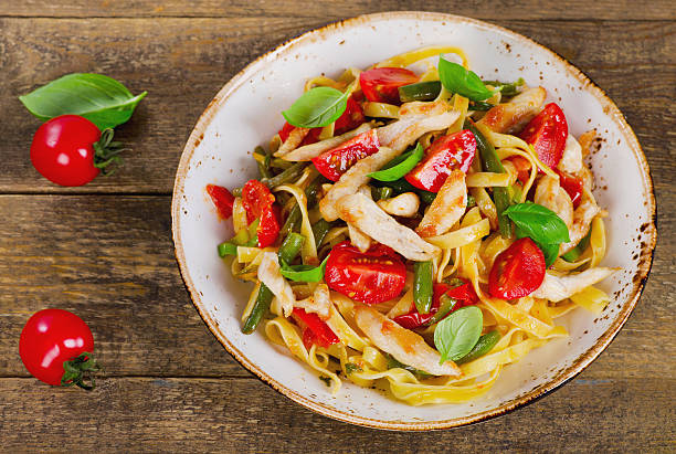 istock Pasta with chicken and vegetables 615989808