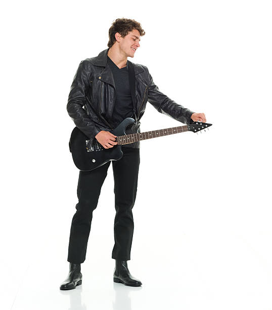 sorrindo homem tocando guitarra - isolated on white studio shot guitar young men - fotografias e filmes do acervo