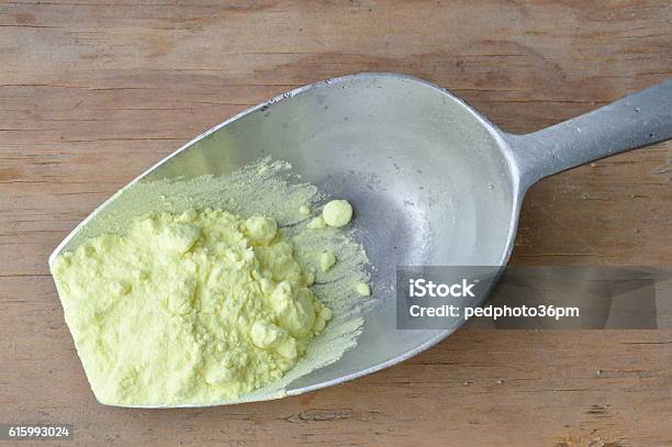 Sulfur Powder On Iron Scoop Stock Photo - Download Image Now - Sulphur, Iron - Metal, Acid