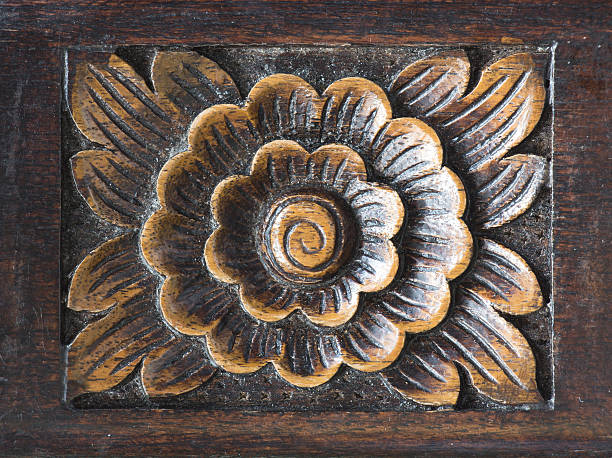 istock Pattern of flower carved on wood background. 615994908