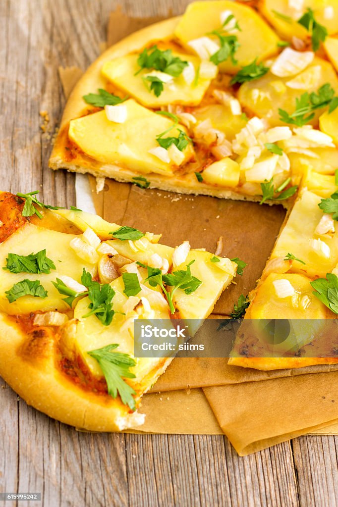 Vegan Potato Pizza Delicious & healthier version of the classic cheesy pizza. Appetizer Stock Photo