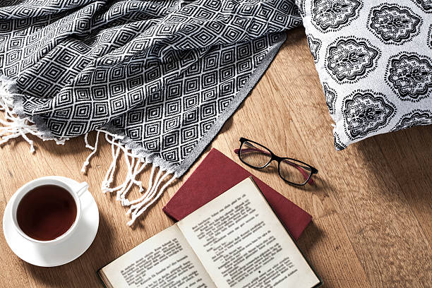 istock Reading book with coffee wooden background 615995900