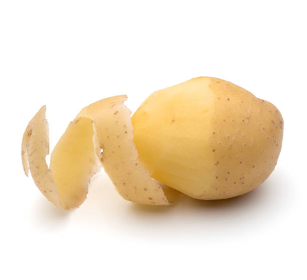istock peeled potato tuber with peel spiral isolated 615996860
